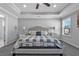Serene main bedroom featuring a queen-size bed, bedside tables, and a large window at 2650 Longacre Park Way, Lawrenceville, GA 30044