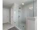 Modern bathroom with a glass-enclosed shower and tiled walls at 2650 Longacre Park Way, Lawrenceville, GA 30044