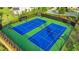 Well-maintained tennis courts with professional lighting and fencing, ideal for tennis enthusiasts at 2650 Longacre Park Way, Lawrenceville, GA 30044