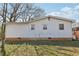 The back of this house is white with several windows and green grass at 340 Brooks Sw Ave, Atlanta, GA 30310