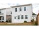 View of the back of the house, showcasing the siding, windows, and small yard at 3739 Silvery Way, Powder Springs, GA 30127