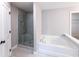 This bathroom boasts a separate tub and a glass-enclosed shower at 3739 Silvery Way, Powder Springs, GA 30127