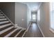 Inviting foyer with wood floors and staircase, bathed in natural light at 3739 Silvery Way, Powder Springs, GA 30127