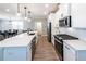 Modern kitchen with stainless steel appliances, white cabinetry, and a spacious countertop at 3739 Silvery Way, Powder Springs, GA 30127