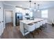 Bright kitchen featuring a large island with seating, stainless steel appliances, and modern fixtures at 3739 Silvery Way, Powder Springs, GA 30127