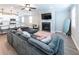 Open-concept living area flows seamlessly with a fireplace, lots of light and modern finishes at 3739 Silvery Way, Powder Springs, GA 30127