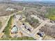 Aerial view showcases the neighborhood's layout with mature trees and community pool at 110 Canyon Ridge Trl, Canton, GA 30114