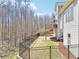 Back exterior view showcasing deck, patio and private fenced backyard, perfect for relaxation at 110 Canyon Ridge Trl, Canton, GA 30114