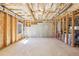 Unfinished basement with exposed framing, a window, and ample space for customization and storage at 110 Canyon Ridge Trl, Canton, GA 30114
