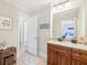 Well-lit bathroom features granite countertops and a passageway into a bedroom at 110 Canyon Ridge Trl, Canton, GA 30114