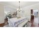Formal dining room featuring wainscoting, hardwood floors, and a chandelier for lighting at 110 Canyon Ridge Trl, Canton, GA 30114