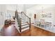 Inviting foyer showcases hardwood floors, elegant staircase, and dining room at 110 Canyon Ridge Trl, Canton, GA 30114