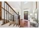 Staircase in entry with dark wood and metal railing leading to the second floor at 110 Canyon Ridge Trl, Canton, GA 30114