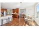 Spacious kitchen with hardwood floors, wooden cabinetry, stainless steel appliances, and breakfast nook at 110 Canyon Ridge Trl, Canton, GA 30114