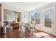 Bright breakfast nook with access to a deck and views of the living room fireplace at 110 Canyon Ridge Trl, Canton, GA 30114