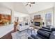 Inviting living room with a fireplace, high ceilings, open layout, and hardwood floors at 110 Canyon Ridge Trl, Canton, GA 30114