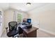 Comfortable home office with neutral colors and bright window at 110 Canyon Ridge Trl, Canton, GA 30114
