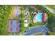 An aerial view featuring tennis courts, playground, pool, and other community amenities nestled within lush greenery at 172 Knightwood Point, Acworth, GA 30101
