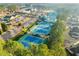 Aerial view of the community with multiple tennis courts, a clubhouse, and lush landscaping, perfect for sports enthusiasts at 172 Knightwood Point, Acworth, GA 30101