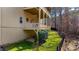 Exterior view of the backyard, complete with a wood deck and a well-maintained lawn, enhancing the property's charm at 172 Knightwood Point, Acworth, GA 30101