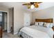 Comfortable bedroom features a ceiling fan, neutral walls, and a closet for storage at 172 Knightwood Point, Acworth, GA 30101