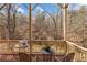 Inviting deck features outdoor seating, creating a relaxing space with scenic views at 172 Knightwood Point, Acworth, GA 30101