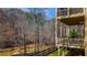 View from the wood deck showcasing a scenic view of the trees and small creek for enjoying natural beauty at 172 Knightwood Point, Acworth, GA 30101