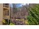 Second-story deck featuring wooded view, and a tranquil setting for outdoor relaxation at 172 Knightwood Point, Acworth, GA 30101