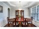Elegant dining room with a wood table, decorative chandelier, and large china cabinet for a grand Gathering gathering at 172 Knightwood Point, Acworth, GA 30101