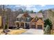 Charming two-story home with a covered front porch and a two-car garage, surrounded by lush landscaping at 172 Knightwood Point, Acworth, GA 30101