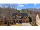 Beautiful two-story home with stone and wood accents, a covered front porch, and a well-manicured lawn at 172 Knightwood Point, Acworth, GA 30101