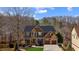 Beautiful two-story home with stone and wood accents, a covered front porch, and a well-manicured lawn at 172 Knightwood Point, Acworth, GA 30101