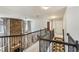 Second floor foyer featuring a stone accent wall, staircase, and an open railing at 172 Knightwood Point, Acworth, GA 30101