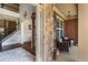 Grand foyer with hardwood floors, a staircase, and a view of the front porch with stone accents at 172 Knightwood Point, Acworth, GA 30101