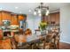 Spacious kitchen features a center island, stainless steel appliances, wooden cabinets, and an adjacent dining area at 172 Knightwood Point, Acworth, GA 30101