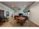 Open-concept living room showcases a dart board, ample seating, and dining area with lots of light at 172 Knightwood Point, Acworth, GA 30101
