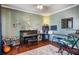 A well-lit music room with a piano, keyboard, and musical instruments is staged for a comfortable and artistic atmosphere at 172 Knightwood Point, Acworth, GA 30101