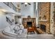 Spacious living room with soaring ceilings, stone fireplace, built-in cabinet, and comfortable seating at 172 Knightwood Point, Acworth, GA 30101