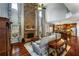 Open-concept living area boasts stone fireplace, vaulted ceiling, and a spacious seating area with lots of natural light at 172 Knightwood Point, Acworth, GA 30101
