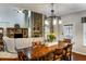 Open concept living room with stone fireplace, soaring ceilings, large windows, and a cozy seating area at 172 Knightwood Point, Acworth, GA 30101