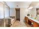 Luxurious primary bathroom features a glass shower, soaking tub and double vanity sinks providing comfort and convenience at 172 Knightwood Point, Acworth, GA 30101