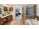 Well-appointed primary bathroom with soaking tub, walk-in shower, double sink vanity, and neutral color palette at 172 Knightwood Point, Acworth, GA 30101
