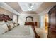 Well-lit main bedroom features a trey ceiling, large dresser, and ensuite bathroom, providing comfort and convenience at 172 Knightwood Point, Acworth, GA 30101