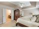 This cozy main bedroom features an ensuite bathroom, neutral colors, and trey ceilings for rest and relaxation at 172 Knightwood Point, Acworth, GA 30101