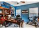 Office with beautiful decor, hardwood floors, built-in cabinet, exercise equipment, and natural light at 172 Knightwood Point, Acworth, GA 30101