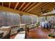 Relaxing outdoor patio with seating, a ceiling fan and wood floors offering backyard views at 172 Knightwood Point, Acworth, GA 30101