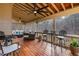 Covered patio with ceiling fans and wood flooring overlooking backyard, perfect for outdoor entertaining at 172 Knightwood Point, Acworth, GA 30101