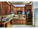The wet bar features rich wood cabinetry, granite countertops, and stainless-steel appliances at 172 Knightwood Point, Acworth, GA 30101