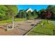 Outdoor workout area with various exercise equipment, benches and bordered by lush trees for an enjoyable fitness experience at 172 Knightwood Point, Acworth, GA 30101