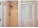 Bathroom shower featuring a shower head and a closet with bi-fold doors at 3701 Rainbow Cir, Snellville, GA 30039